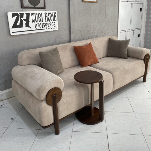 bege 3 seater sofa paired with mahogany wood skirting